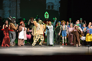 The cast of the Sentinel Upstage Players’s production of Shrek the Musical, Jr. join together in song at NFCC’s Van H. Priest Auditorium on Jan. 28.