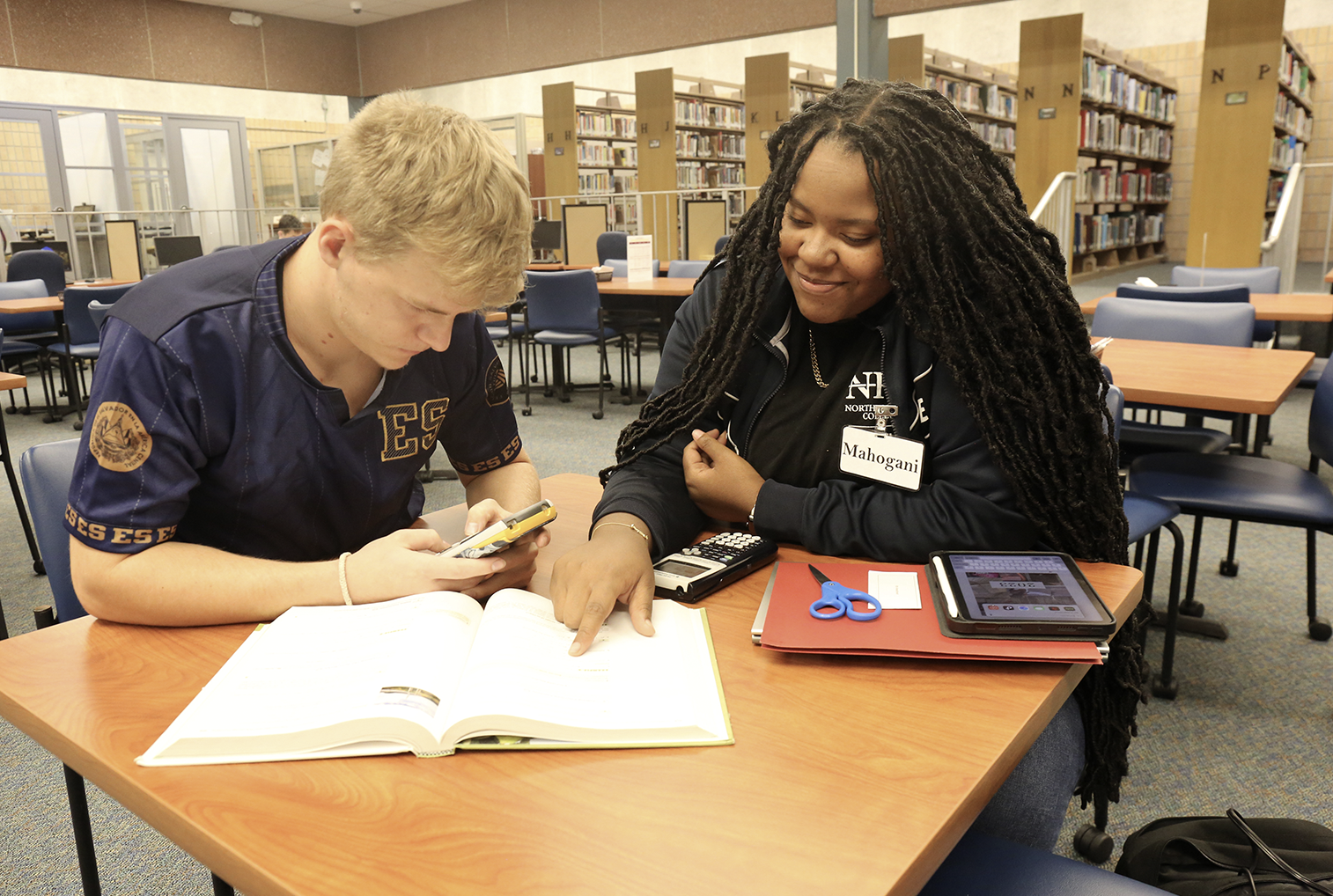 Tutor working with student.