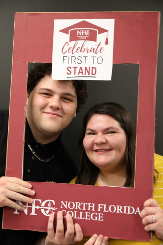 NFC Students (L to R) Jack Agee and Caroline Wynn celebrate Caroline’s accomplishment of becoming a soon-to-be first generation graduate at NFC’s First to Stand Celebration