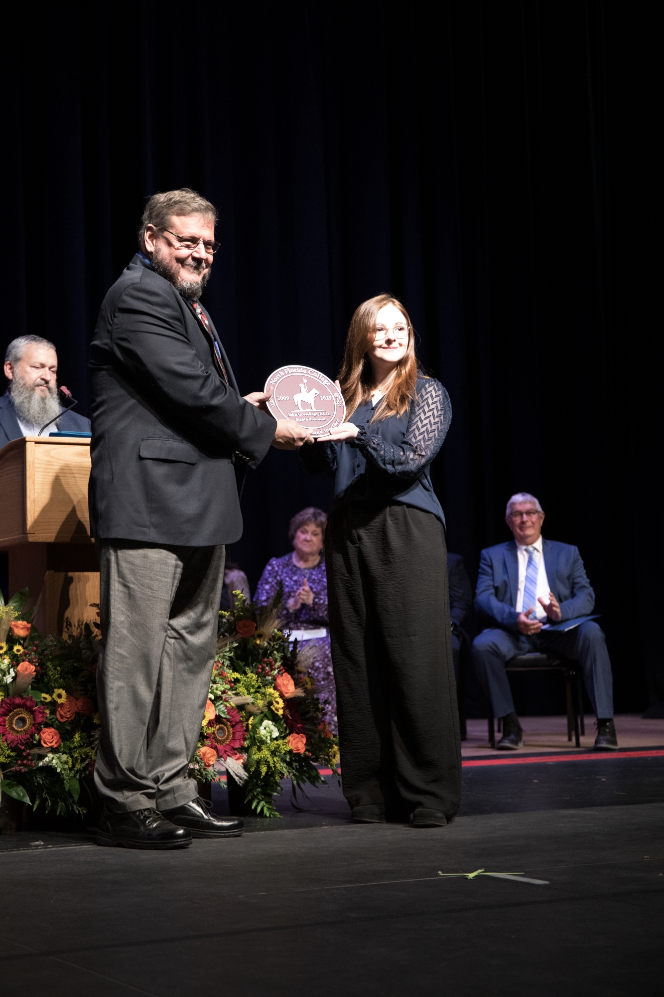 Dr. John Grosskopf and NFC SGA President present a commemorative plaque