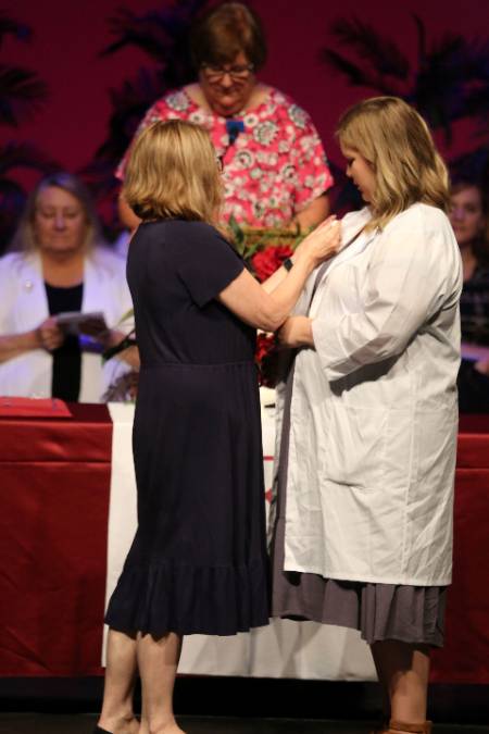 Rebekah Pitts receives her nursing pin during the BSN Pinning Ceremony 2022